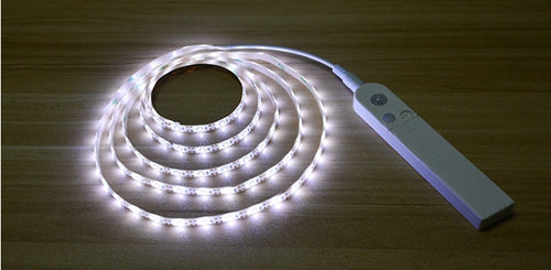 Motion-sensor light strip installed under a shelf